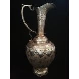 Persian white metal ewer with engraved decoration to body -tested as silver -weight 836g (26.8oz)