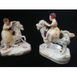 Pair of hard paste Staffordshire figures of children riding goats -largest 4" x 4½" high