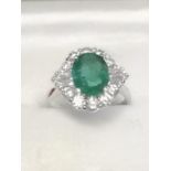 18ct white gold emerald & diamond ring set with central oval shaped emerald (1.79ct)