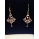 Pair of drop earrings set with rubies & diamonds