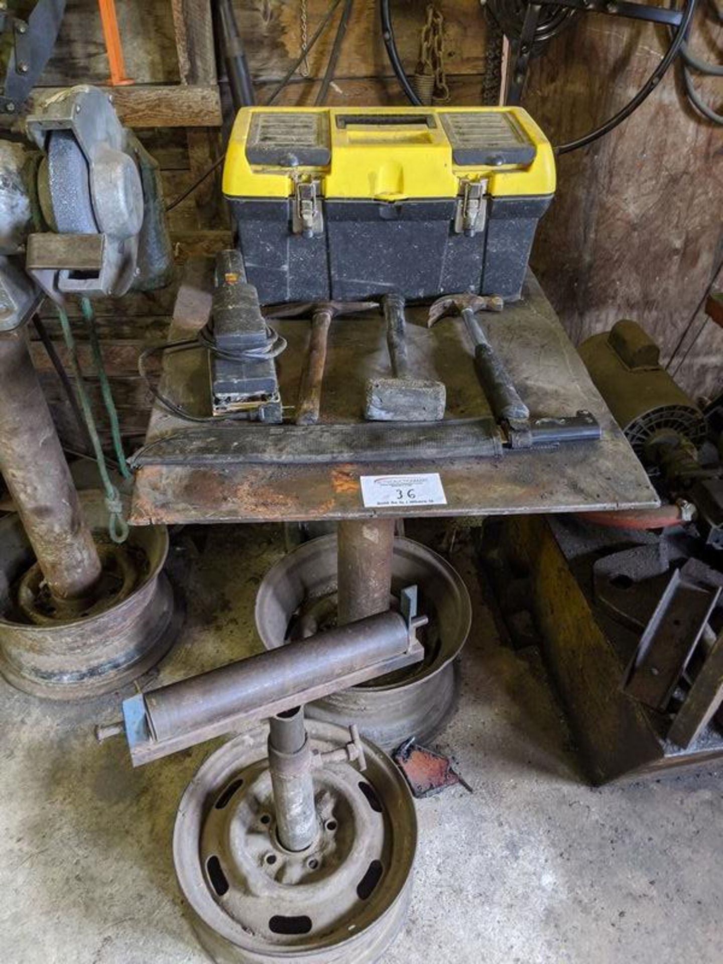 Steel Table with Assorted Tools and Feed