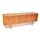 MCINTOSH & CO; a teak sideboard with four central drawers flanked by two panelled cupboard doors,