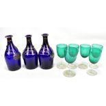 Three Bristol Blue glass decanters inscribed in gilt 'Rum', 'Hollands' and 'Brandy', three silver