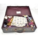 A suitcase of textiles, predominantly small textile fragments and panels, including 1950s and 60s