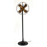 A floor standing electrical fan, with cast metal body, marked WS, height 160cm.