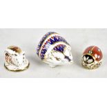 ROYAL CROWN DERBY; three paperweights comprising piglet (gold stopper), ladybird (gold stopper)