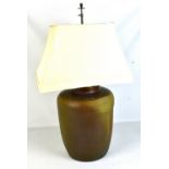 A Chinese brown glazed ovoid table lamp with twin bulb fitment, height 78cm.  Provenance: Private