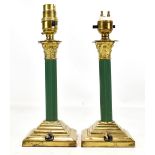 A pair of gilt metal Corinthian column table lamps with green detail, height excluding fitment 18.