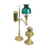 Two 20th century brass oil lamps including an adjustable example, height 54cm.