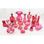 A group of cranberry glass including enamel decorated vase and jugs, large jug, bowl, etc.Additional