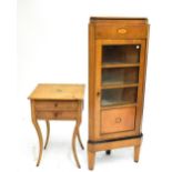 An early 20th century walnut and inlaid corner cabinet, the single glazed door enclosing three
