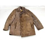 A gentleman's sheepskin coat with leather toggles.