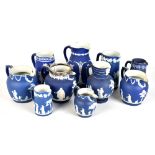 WEDGWOOD; a group of blue jasper dip jugs, one with plated mounts, the largest approx 19cm.