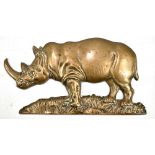 A late 19th century bronze plaque modelled as a rhino with two circular fittings to reverse and