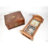 An early 20th century mahogany canteen (empty), together with a modern oak cased wall clock (2).