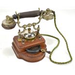 LM ERICSSON & CO OF STOCKHOLM; an early 20th century telephone with nickel plated mounts on mahogany