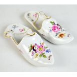 DRESDEN; a pair of floral decorated slipper ornaments, each with blue painted crossed swords mark to