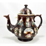 A 19th century Bargeware teapot, with impressed plaque inscribed 'Betsy Cooper Arnold, 1879', height