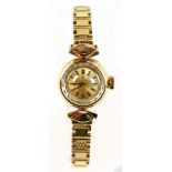 OMEGA; a lady's 9ct gold wristwatch, the circular dial with baton numerals, diameter of face