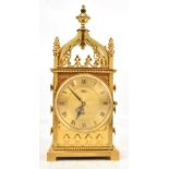 IMHOF; a Swiss gilt brass Gothic-style carriage clock, the circular dial set with Roman numerals and