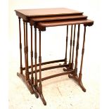 An Edwardian inlaid mahogany nest of three graduated coffee tables.