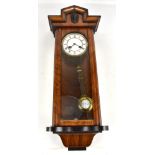 An early 20th century walnut cased Vienna wall clock, the circular dial set with Roman numerals,