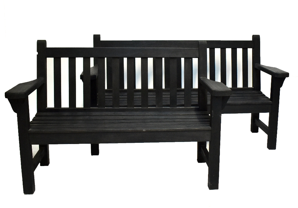 A near pair of garden benches, one a three seater, the other a two seater, each with slatted