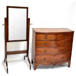 An Edwardian mahogany and inlaid cheval mirror on four legs to casters, 150 x 64cm, and a bow