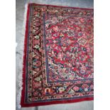 A red ground Gabral floor rug. Additional InformationDimensions are 326 x 210cm.