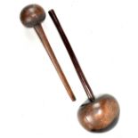 A large African wooden knobkerrie, diameter of top 17cm, together with a similar smaller example (
