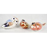ROYAL CROWN DERBY; three paperweights comprising owl (lacking stopper), robin (gold stopper) and