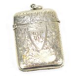 ISAACK SILVERSTON & CO; a Victorian hallmarked silver vesta case with foliate engraving and shield