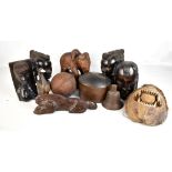 Four African tribal figures and heads, a further tribal style mask, a wooden hat block, etc.