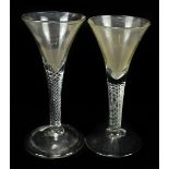 Two 19th century Dutch air twist stem wine glasses, copies of 18th century examples, height 17cm. (1
