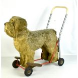 A plush dog on trolley, approx 60 x 66cm.Additional InformationVery dirty, the plush is thinning