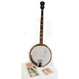 A German banjo with extra strings and chord book (3). Additional InformationNeck appears straight.