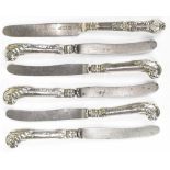 A set of four hallmarked silver handled pistol grip butter knives and two other examples (6).