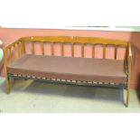 An Arts & Crafts oak day bed, width 185cm.