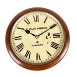 A late 19th century mahogany circular wall clock, the painted dial inscribed 'E. Cartwright, Harrow'