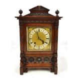 LENZKIRCH; a late 19th/early 20th century German oak cased mantel clock, the silvered chapter ring