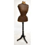 A tailor's mannequin on ebonised tripod stand, height 145cm.Additional InformationPartially