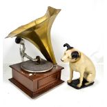 An oak cased table top wind-up gramophone with brass horn, and a resin figure in the style of Nipper