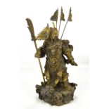 A Chinese hollow cast bronze figure of Guan Gong Yu with flags and guandao/pudao on base featuring