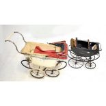 Two prams for restoration, the larger cream painted example length 100cm.