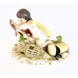 MEISSEN; a late 19th/early 20th century figure of a putto holding fish beside a fishing net and