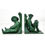 A pair of Art Deco green painted bronze book ends modelled as Don Quixote and Sancho Panza resting