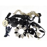 A small group of costume jewellery to include French jet necklaces, a base metal locket, etc.