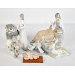 A mixed group of ceramic figures including Nao duck group, Lladro sleeping Christ, four similar