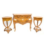 A reproduction bird's eye maple veneered two drawer bombé commode raised on square section