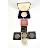 Small group of commemorative crowns, two Canadian coins, also a hallmarked silver Apollo 11